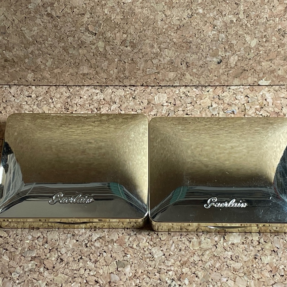 Set of four palettes: Guerlain, Laura Mercier, and MAC